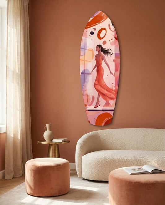 Woman in red surfboard glass wall art on a terracotta wall above a cream curved sofa and peach ottomans
