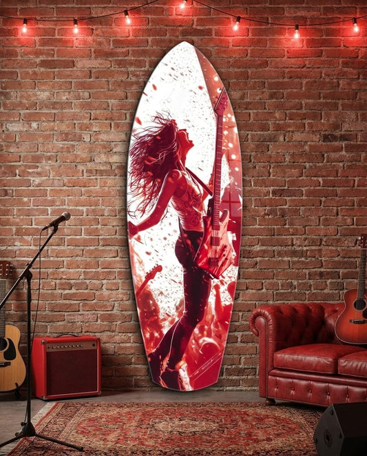 Rock guitarist surfboard glass wall art on a red brick wall above a red leather sofa beside guitars and an amp