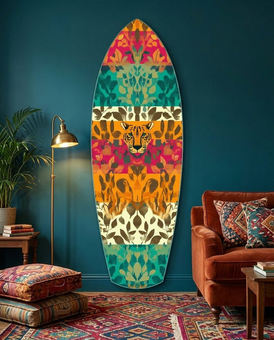 Wild cat leaf stripes surfboard glass wall art on a teal wall above a rust velvet sofa and a patterned rug