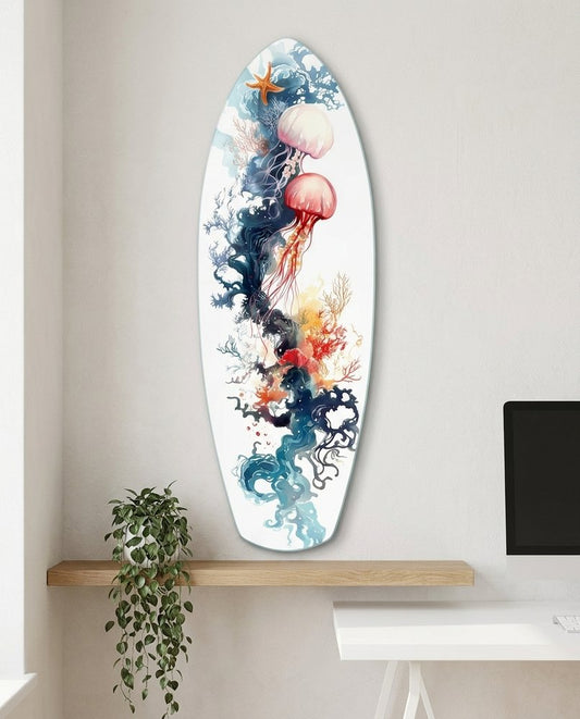 Watercolor Jellyfish and Coral surfboard glass wall art above a white floating desk with a trailing plant and a monitor