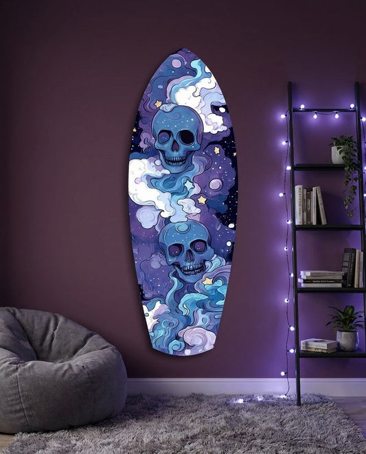 Indigo skulls surfboard glass wall art on a purple wall with fairy lights above a gray bean bag