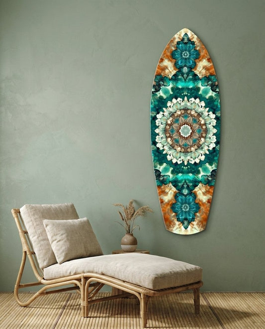 Teal mandala surfboard glass wall art on a sage green wall above a rattan lounge chair with cream cushions