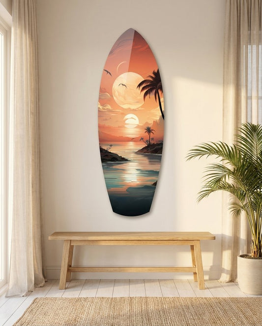 Tropical sunset surfboard glass wall art above a light wood bench beside sheer curtains and a potted palm