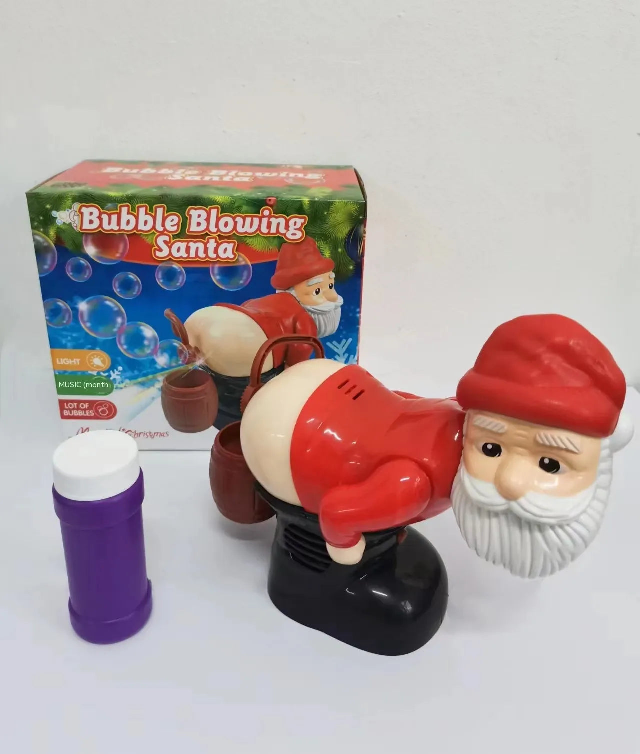 Santa Claus bubble blower with packaging and bubble solution on a white background