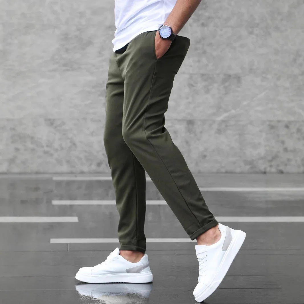 Side angle view of men’s Army Green slim-fit casual stretch pants
