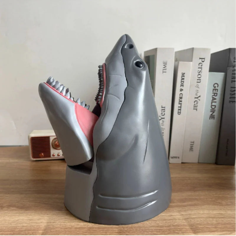Side view of gray shark popcorn bucket showing fin details and pink mouth interior with textured teeth