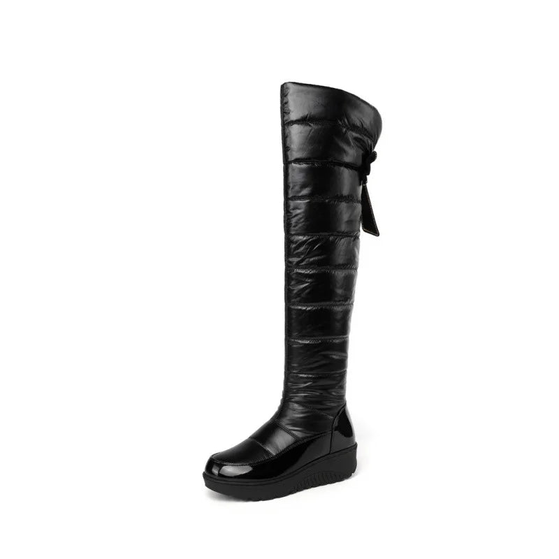 Side view showing full leg coverage and elegant silhouette of over knee winter boots