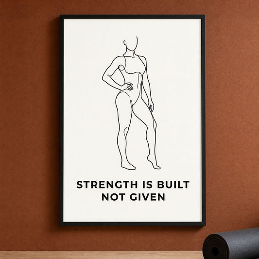 Single line drawing wall art of a standing female figure captioned Strength Is Built Not Given, framed and ready to hang