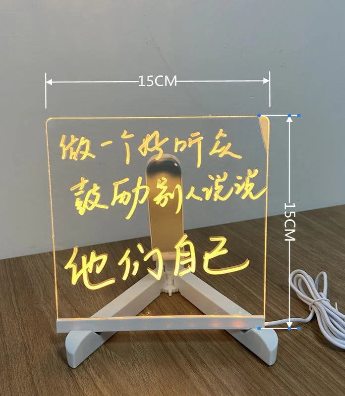 Small square LED acrylic message board showing handwritten glowing notes with size markings.