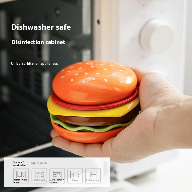 Stackable dish set with burger design held by a hand with text about dishwasher safety and disinfection cabinet use.