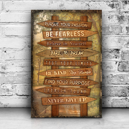 Tall canvas of wooden arrow signs with motivational phrases leaning on a white brick wall, motivational wall art