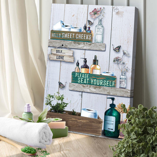 Seat Yourself bathroom canvas sign hanging on wall