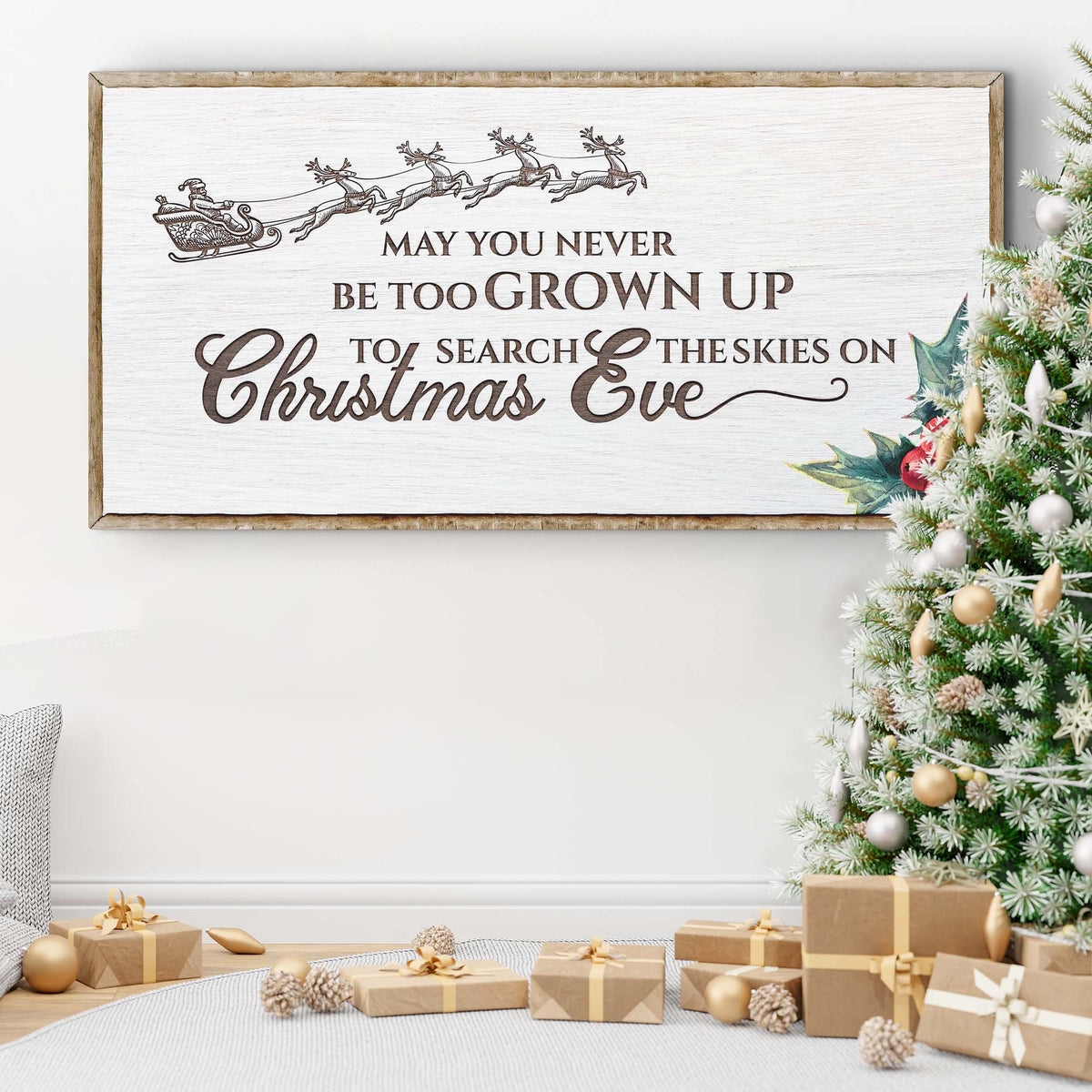 Second style of the Christmas Eve sign in white with a gray sleigh and holly, above wrapped gifts beside a frosted tree