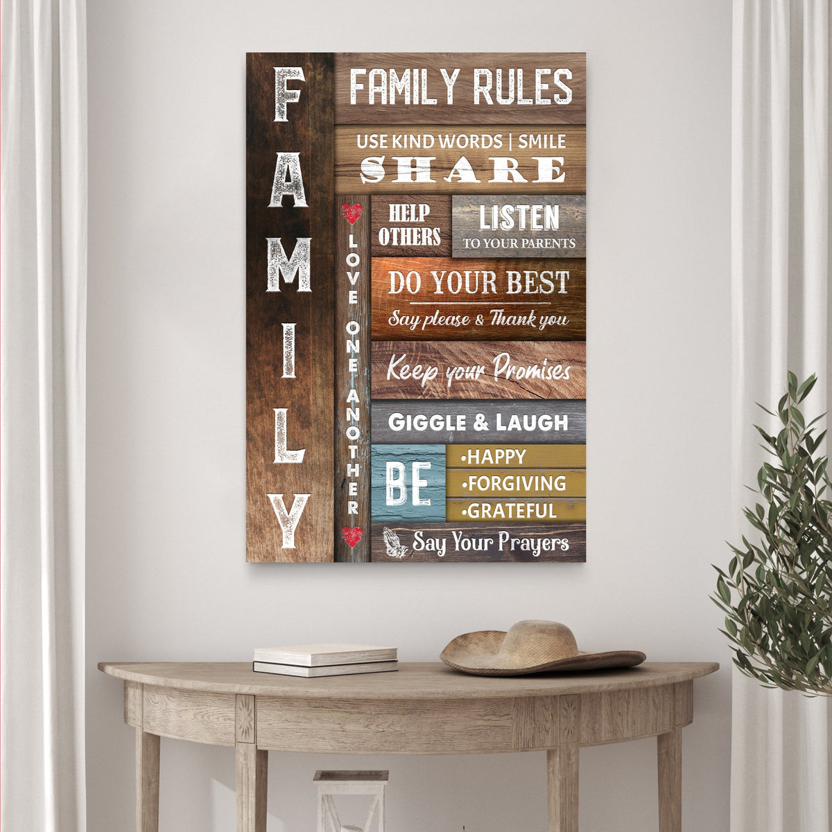 Tall Family Rules canvas sign in a multicolor wood-plank look above a half-moon console table