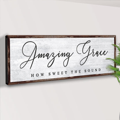 Angled view of the Amazing Grace How Sweet the Sound canvas sign on a pale wall