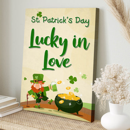 Lucky in Love Leprechaun canvas leaning on a shelf with books and a vase of pampas grass