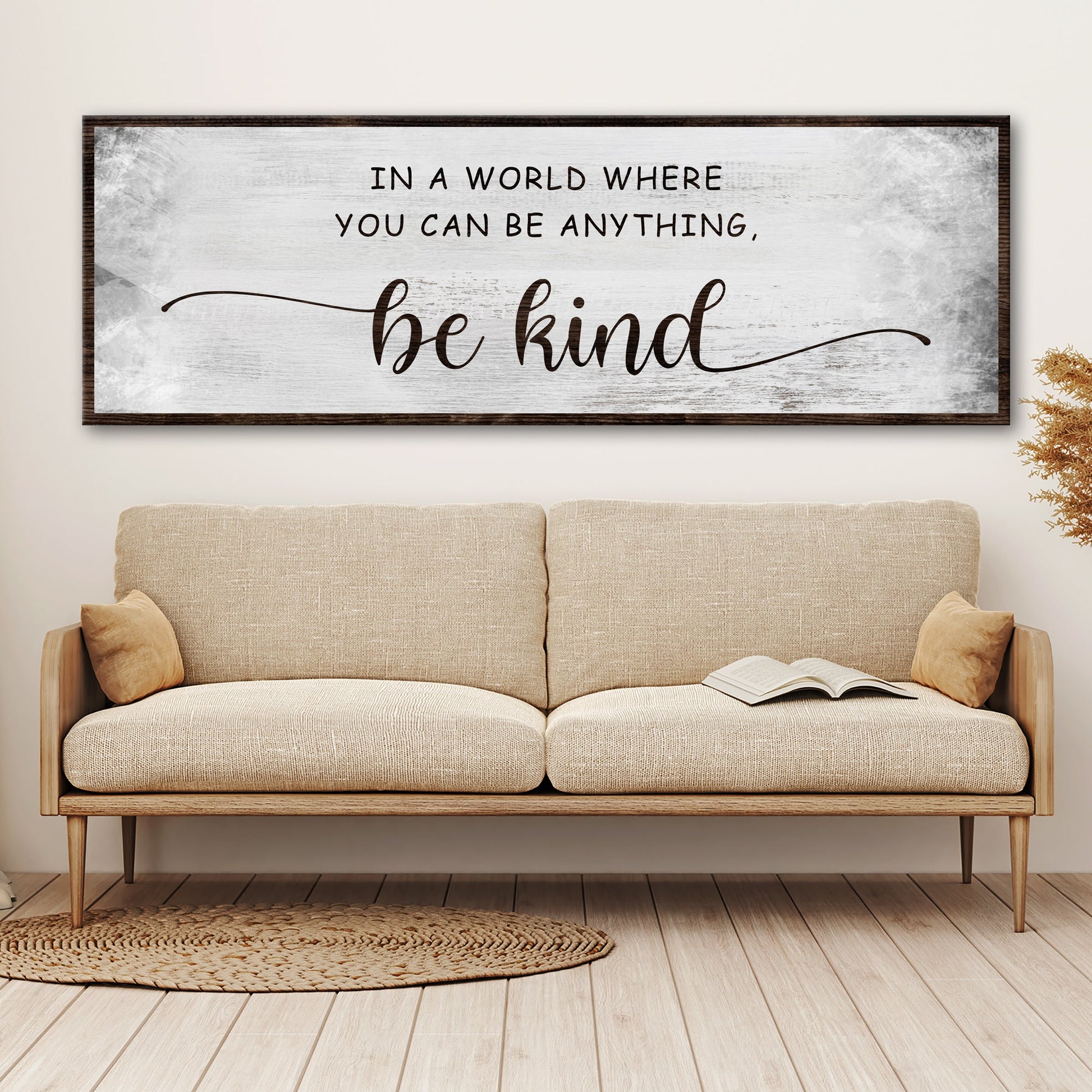 In A World Where You Can Be Anything Be Kind motivational canvas sign on a wall