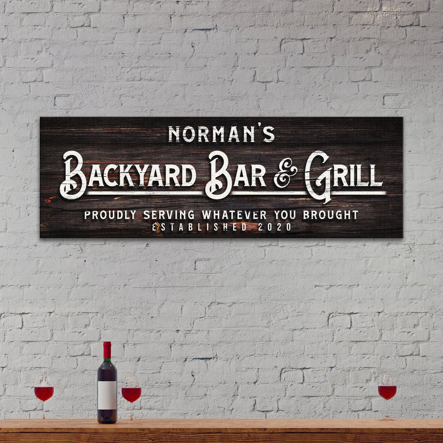 Backyard Bar And Grill personalized rustic word-art canvas sign on a wall