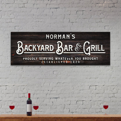 Backyard Bar And Grill personalized rustic word-art canvas sign on a wall