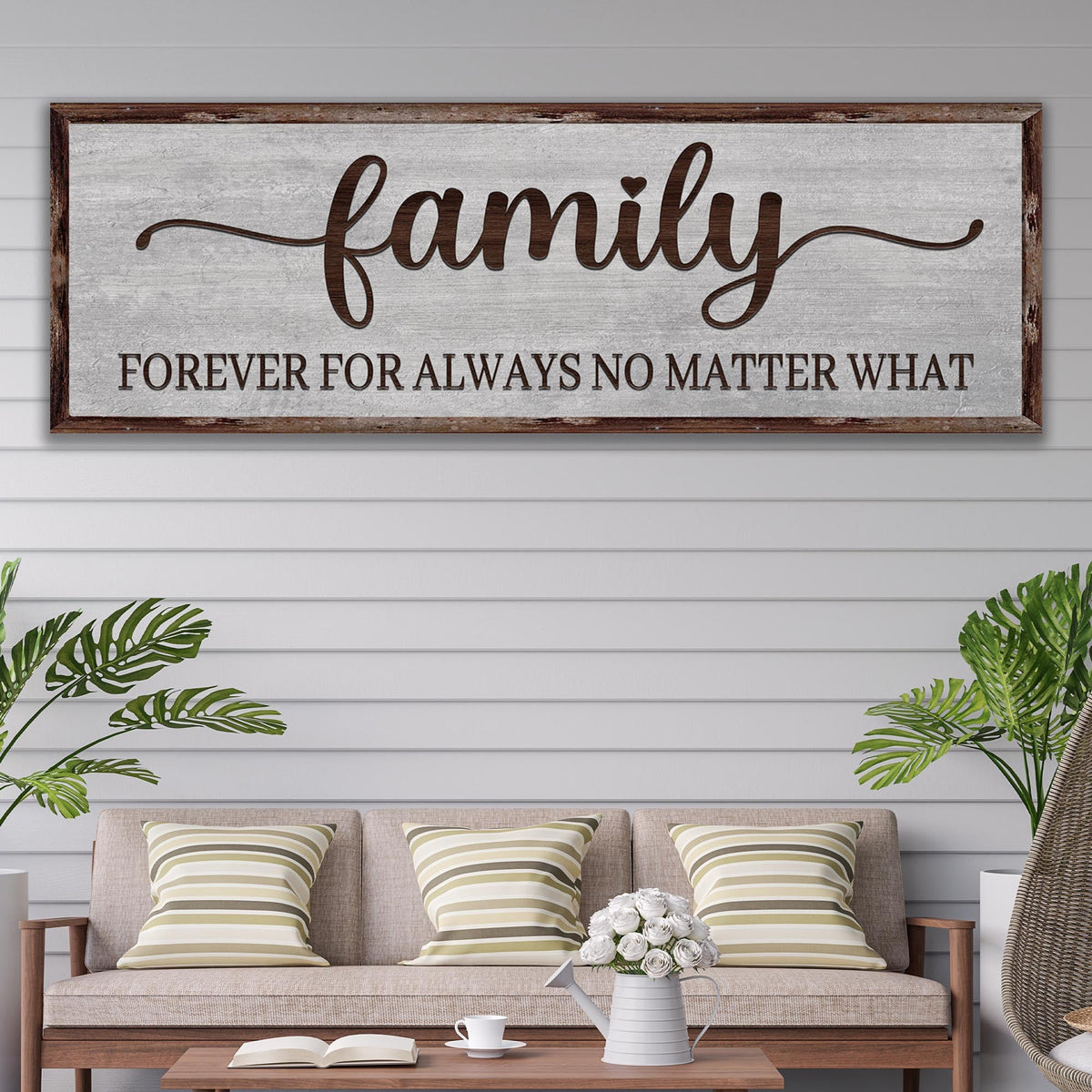 Family Forever For Always No Matter What canvas sign in gray wood look, hung above a porch bench with striped pillows