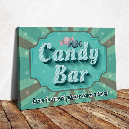 Candy Bar canvas sign with striped teal letters, two wrapped candies and Love is sweet please take a treat, on a wood table