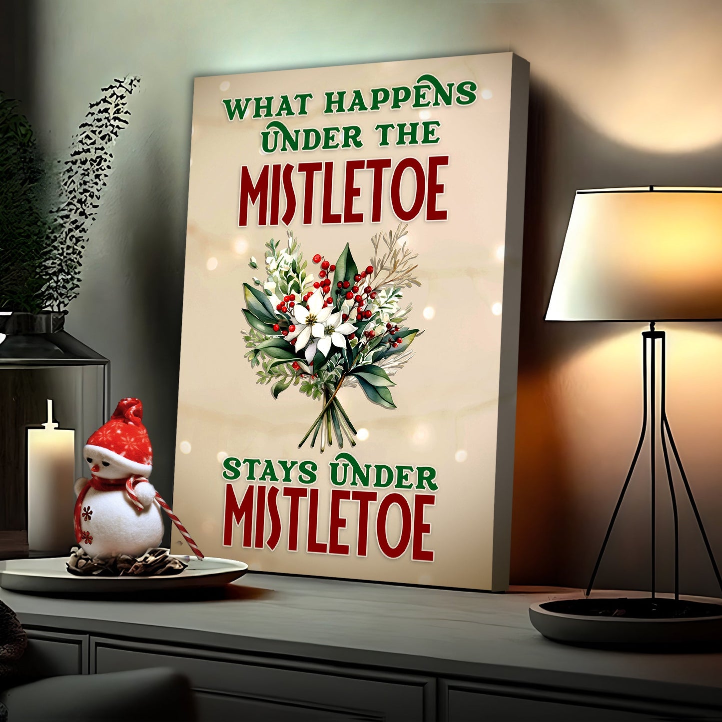 What Happens Under The Mistletoe funny holiday canvas sign with festive mistletoe typography