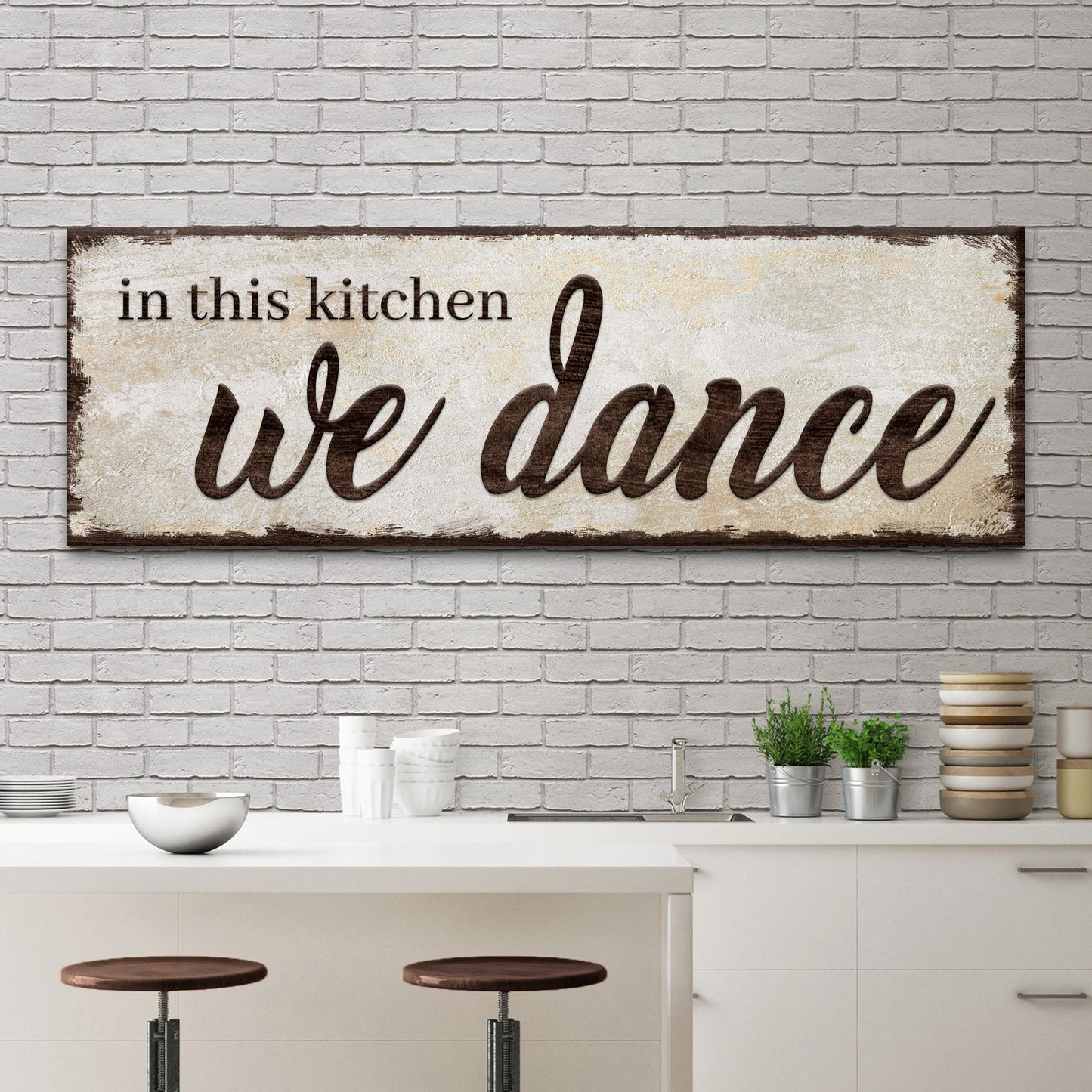 In This Kitchen We Dance canvas wall art sign with bold joyful lettering