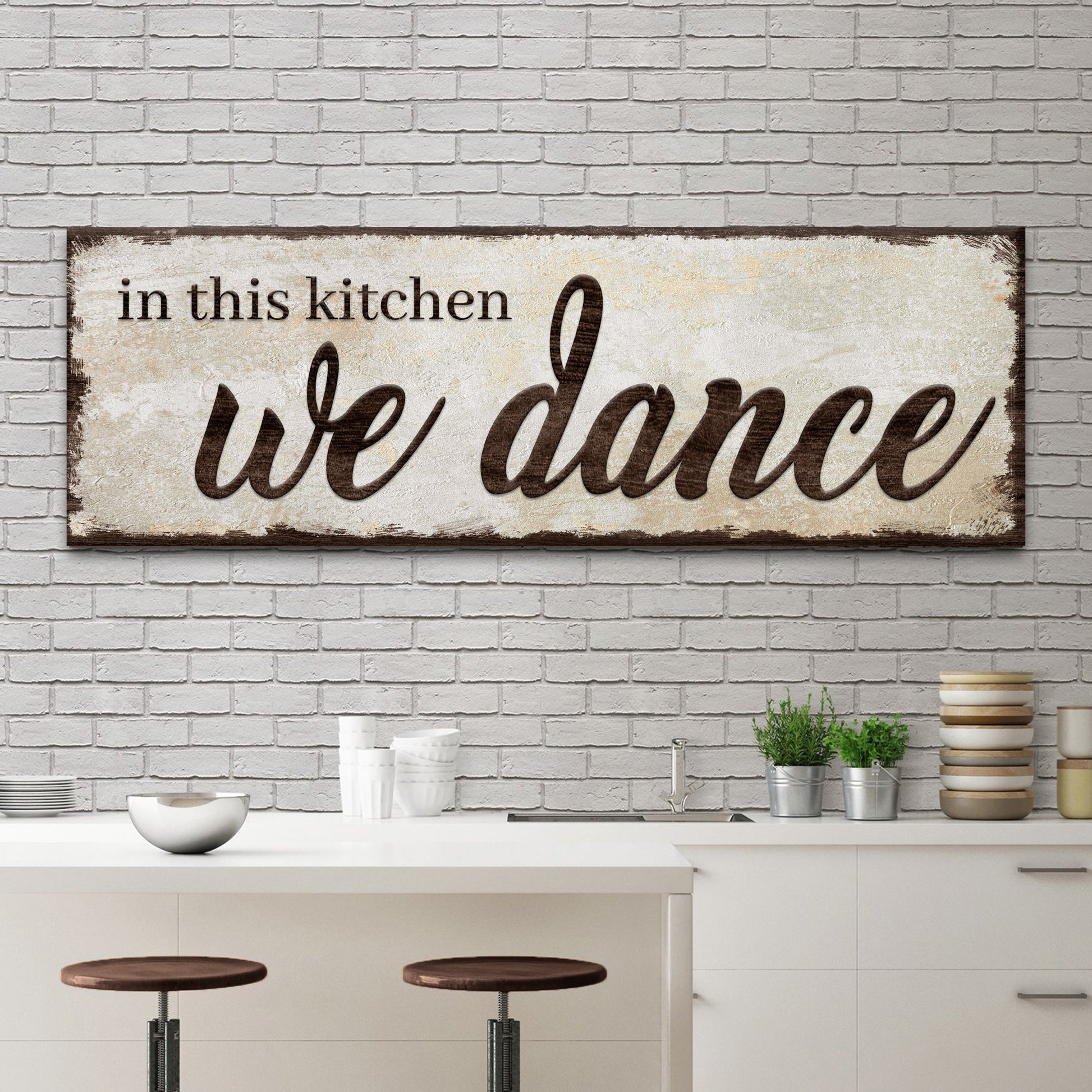 In This Kitchen We Dance canvas wall art sign with bold joyful lettering