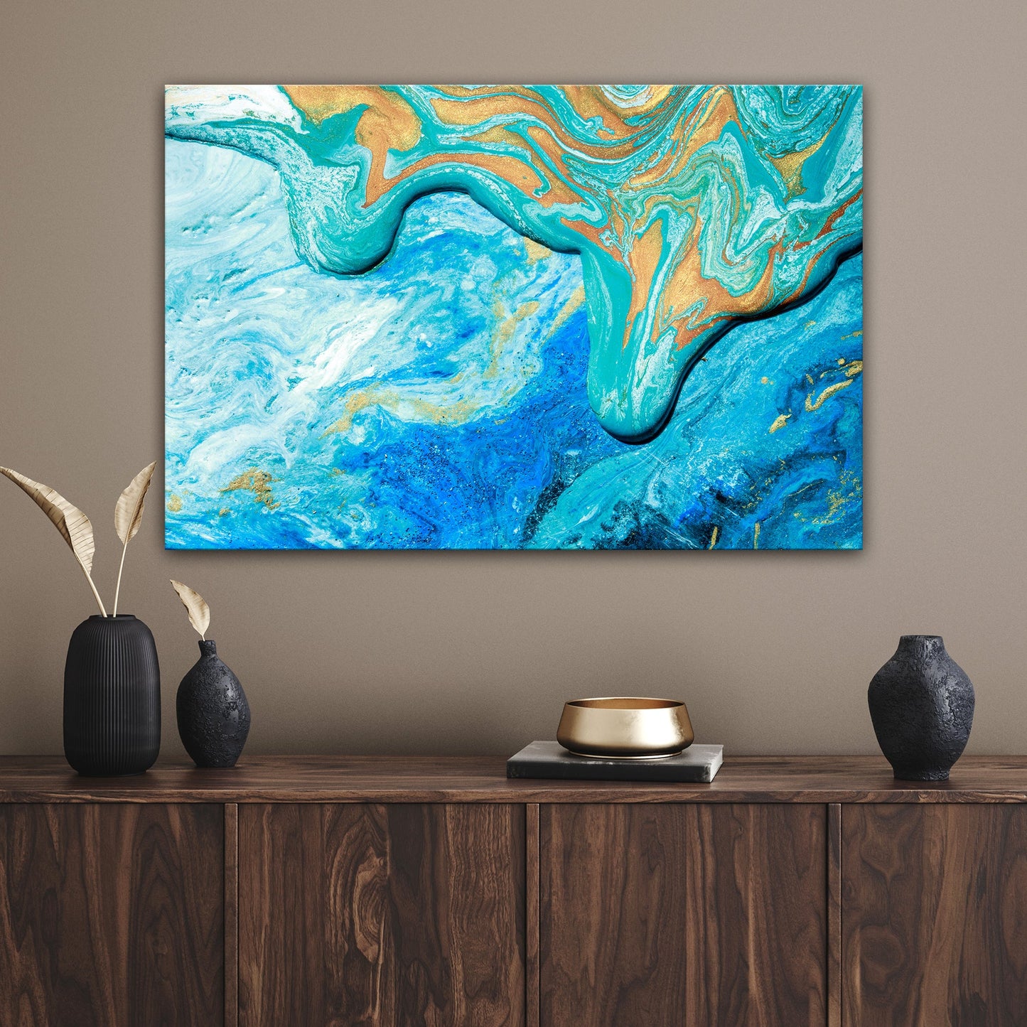 Abstract sea canvas wall art in calm blue tones hanging in a coastal living room