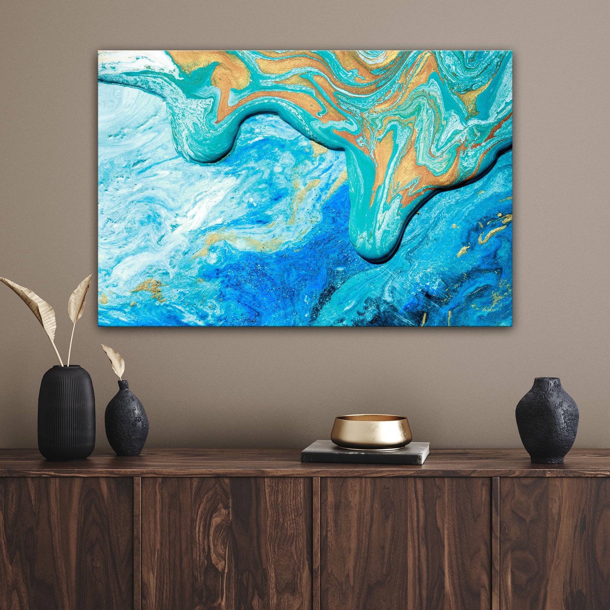 Abstract sea canvas wall art in calm blue tones hanging in a coastal living room