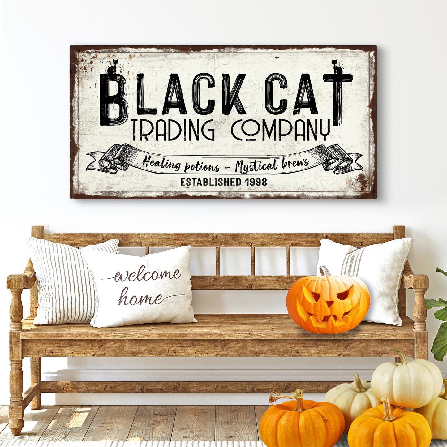 Black Cat Trading Company vintage-style canvas sign hanging on a wall