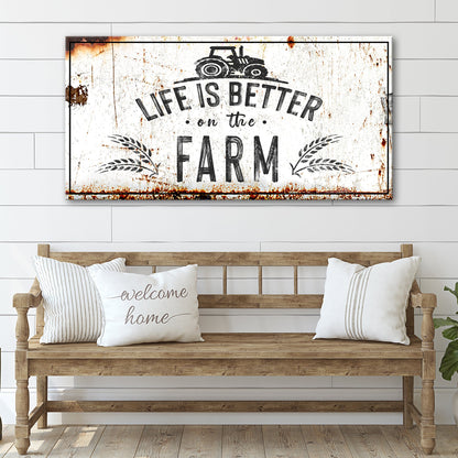 Life is Better on the Farm white canvas sign hung above a wooden bench with pillows on a shiplap wall