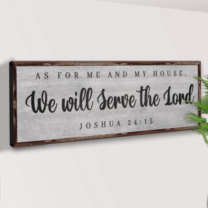 Joshua 24:15 gray canvas sign with a wood-look border seen at an angle on a pale wall
