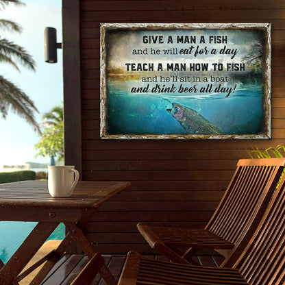Give a Man a Fish fishing canvas on a wood wall of a lakeside porch beside a table and deck chairs