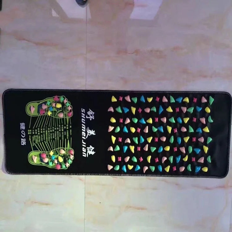 Textured foot massage walking pad showing reflexology points and colorful stone pattern design