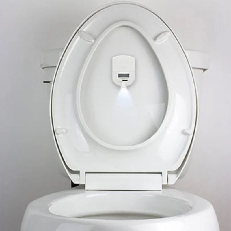 Toilet projection lamp installed inside toilet bowl projecting white light