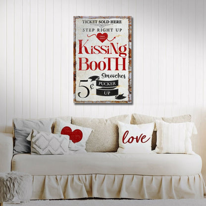 Kissing Booth 5 cent smooches canvas on a white paneled wall above a cream sofa