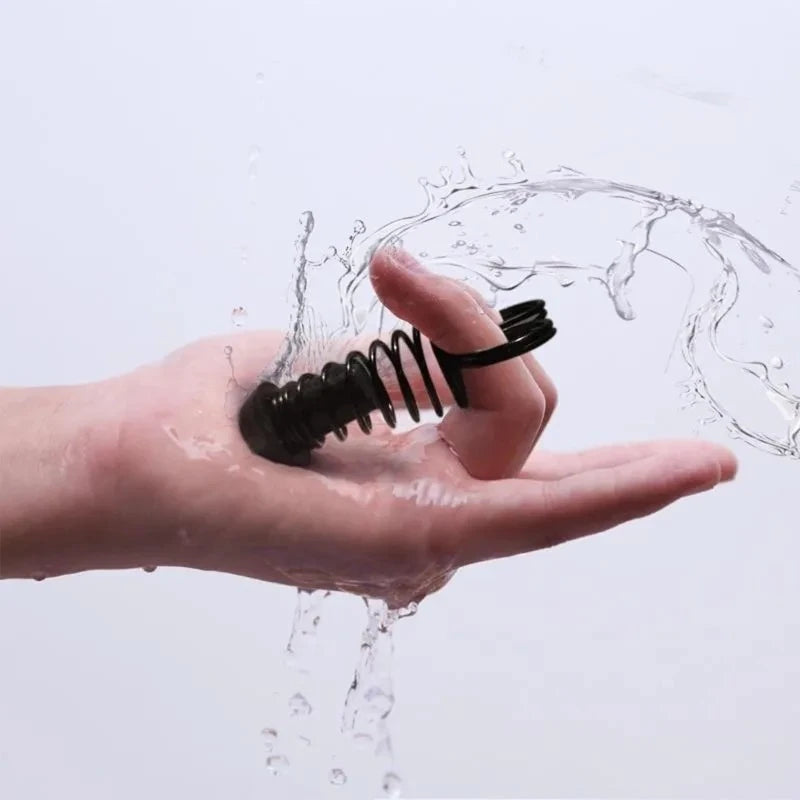 Water splash on finger trainer showing washable water-resistant construction