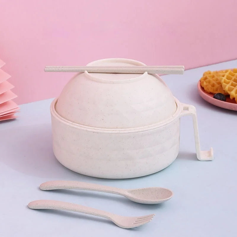 Wheat straw noodle bowl set with lid, spoon and fork displayed on pastel background