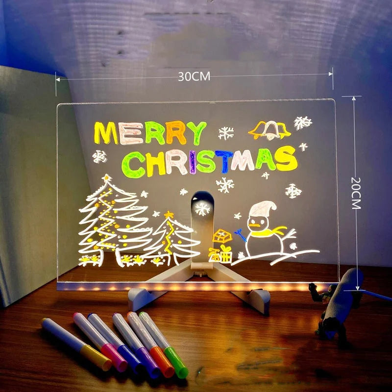 Wide LED acrylic board decorated with a glowing Merry Christmas design and drawings.