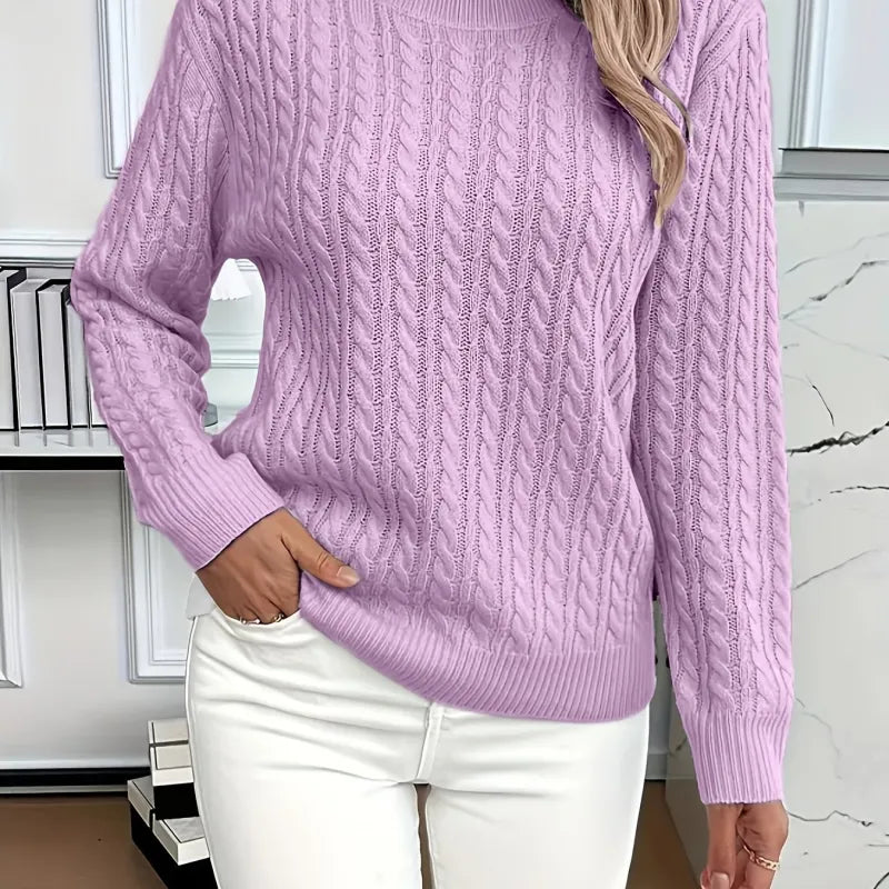 Women’s cable-knit pullover sweater in soft purple, styled with white pants for a cozy and elegant everyday look