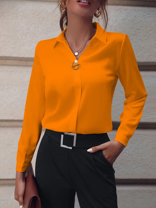 Women’s orange commuter V-neck blouse adding a vibrant pop of color