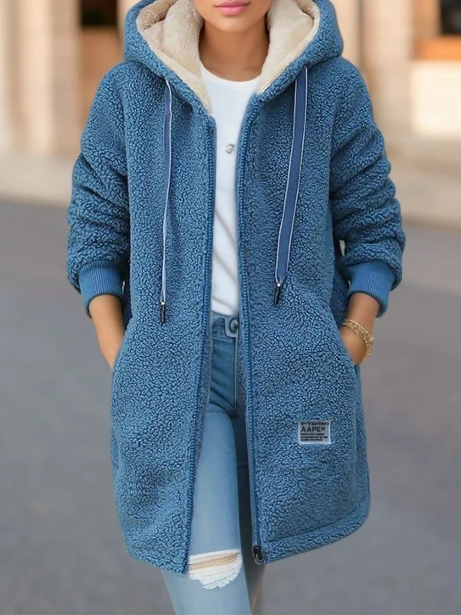 Women’s soft blue fleece hooded jacket with plush lining for cold-weather comfort
