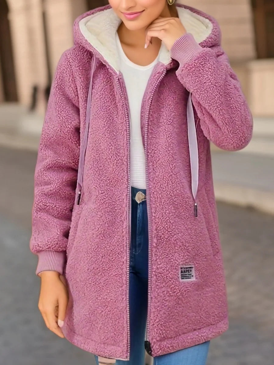 Women’s warm fleece-lined hooded jacket in rose pink, perfect for a cozy outdoor style