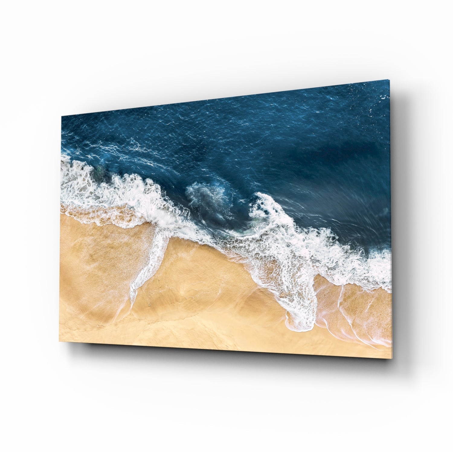 Ocean waves crashing glass wall art, aerial indigo surf on honey sand, on high-gloss tempered glass