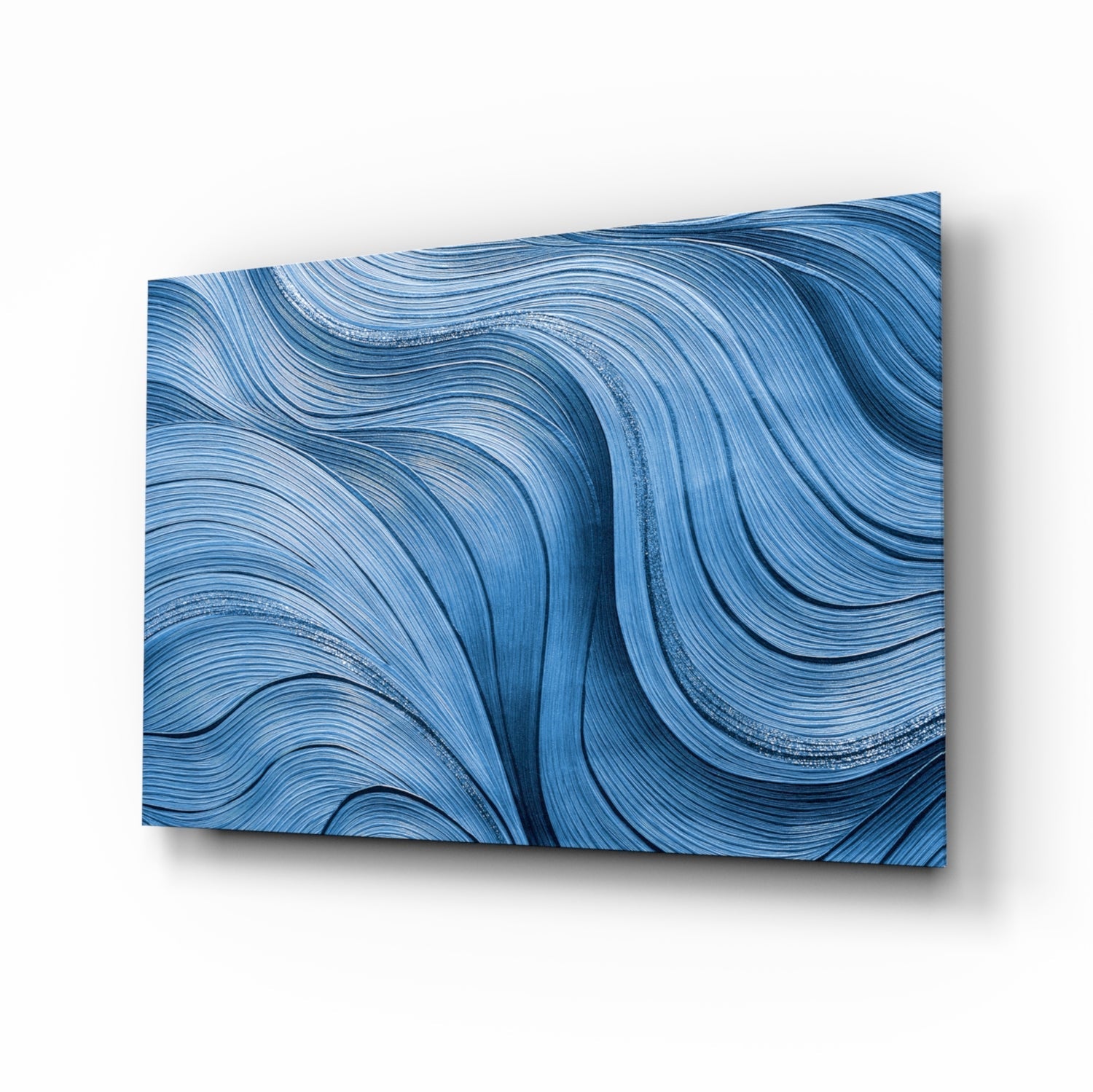 Ocean waves glass wall art in sapphire and silver-blue painterly ribbons on high-gloss tempered glass