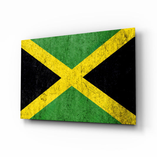 Weathered Jamaica flag glass wall art: a gold diagonal cross with green and black triangles on a speckled, worn surface