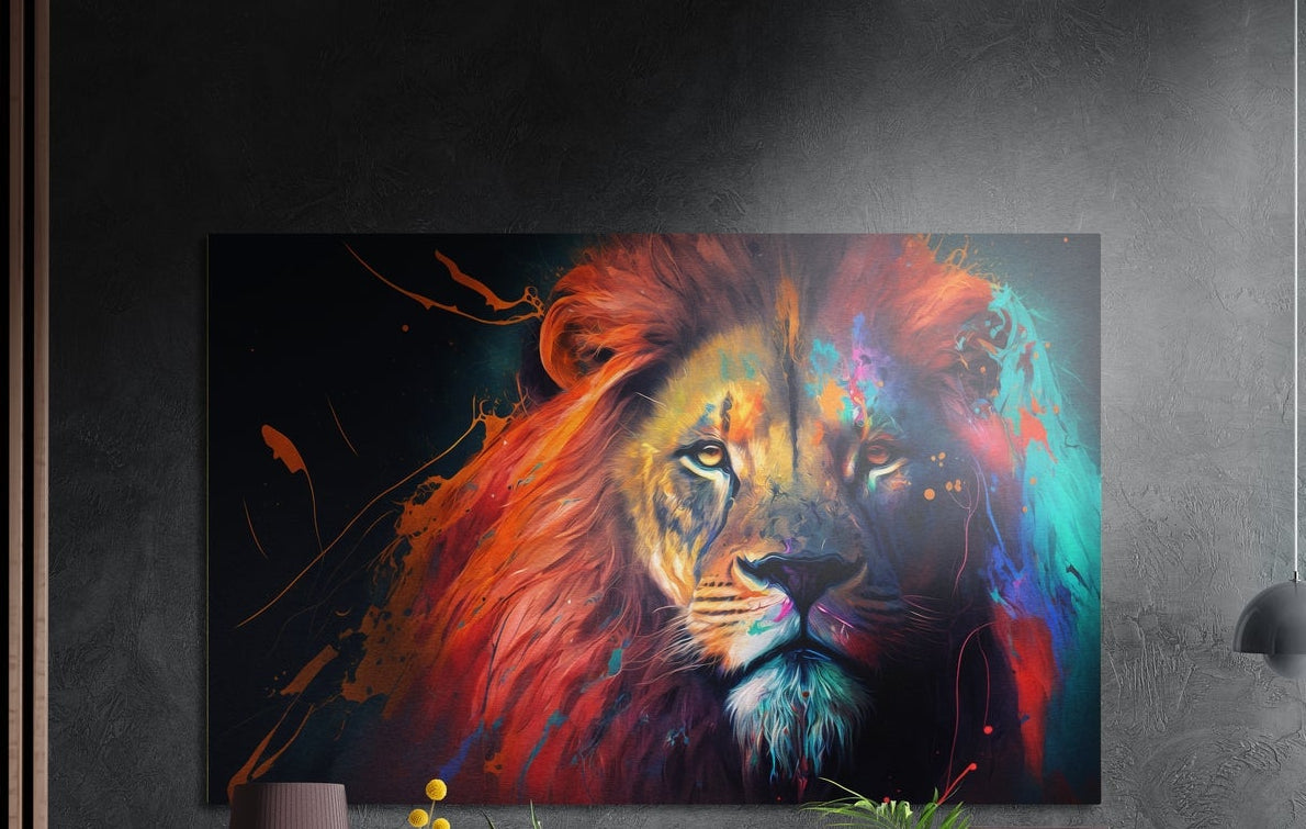 Lion with a crimson and rainbow splash mane on black, brushed aluminum wall art on a gray wall above yellow flowers