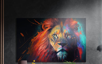 Lion with a crimson and rainbow splash mane on black, brushed aluminum wall art on a gray wall above yellow flowers