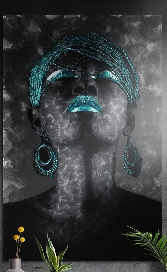 Woman with teal lips, beaded head wrap and hoop earrings, brushed aluminum wall art on a dark wall above plants